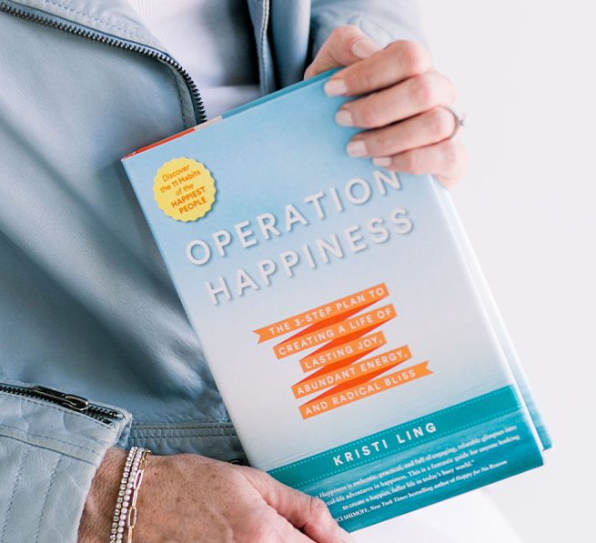 Operation Hapiness book in woman's hand